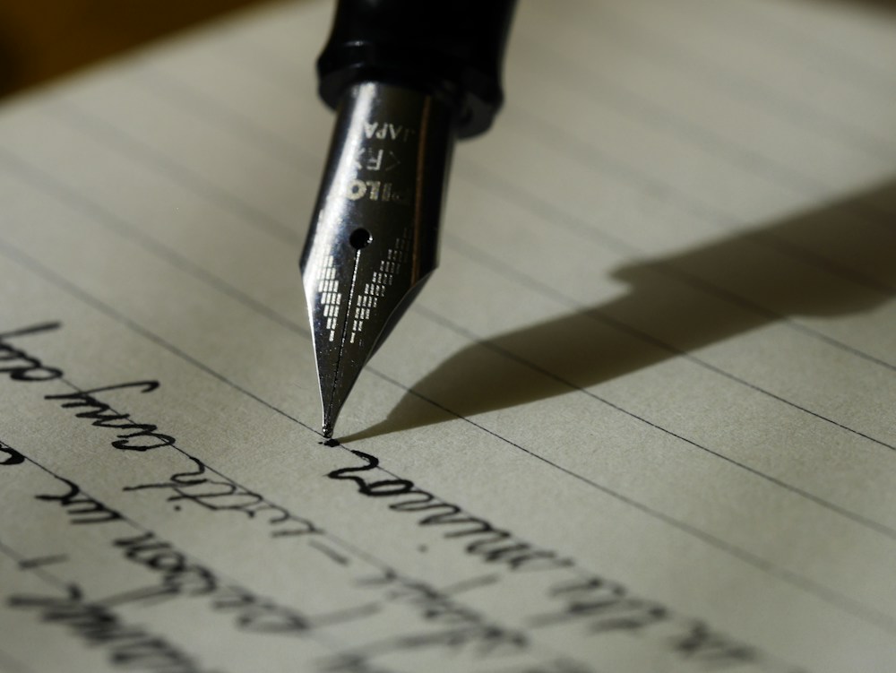 Handwritten notes and a pen used to clarify ideas and communication priorities
